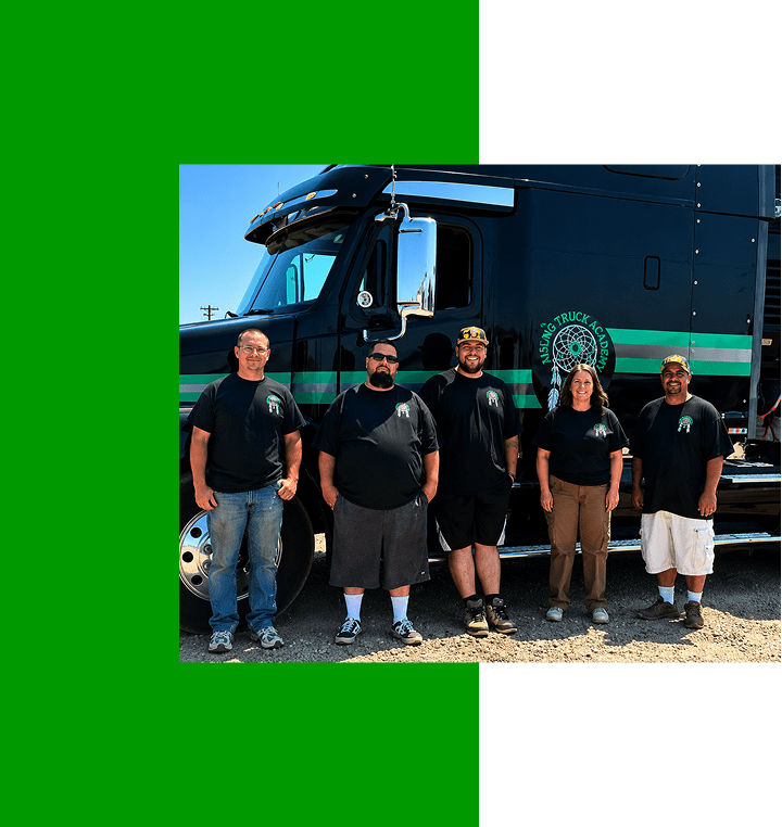 Team in matching shirts by truck