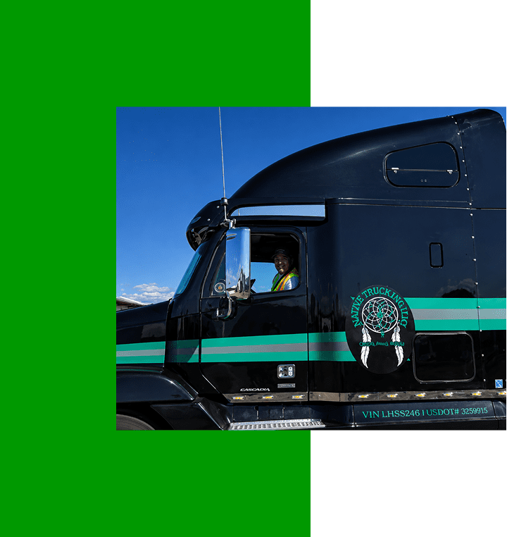 Black semi-truck with green stripes